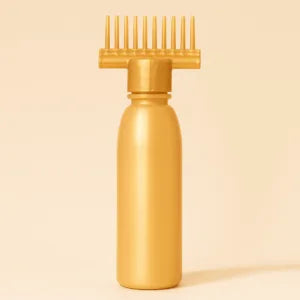 Yellow hair oil bottle with a brush on a white background